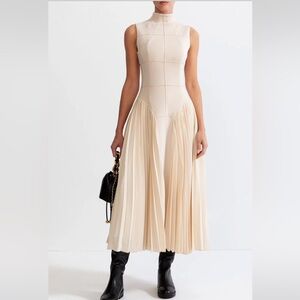 Ivory sleeveless pleated dress